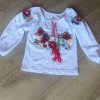 Дитяча трикотажна вишиванка-футболка з довгим рукавом та квітковим орнаментом